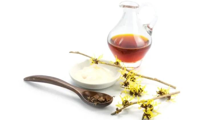 Witch hazel for hemorrhoids sitting on a white background.