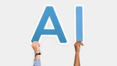 People holding letters that form ‘AI,’ symbolizing artificial intelligence used in modern local marketing